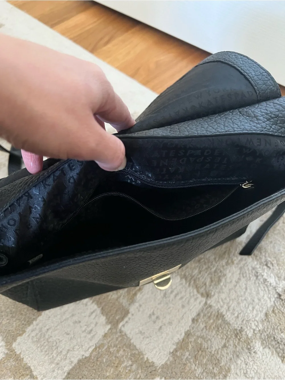 kate spade Black Pebbled Leather Backpack with Gold-Tone Turn Lock